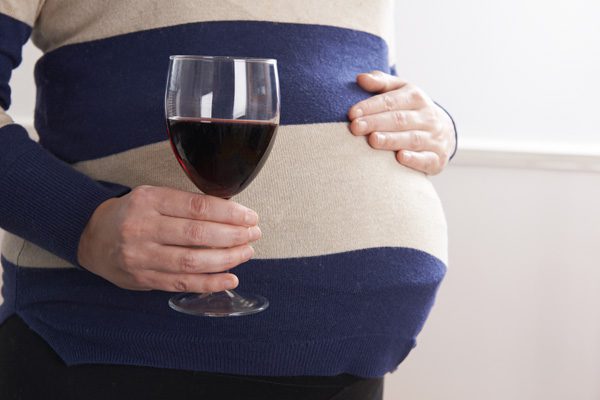 health consequences of prenatal exposure to drugs & alcohol - pregnant woman with a glass of wine - mountain laurel recovery center