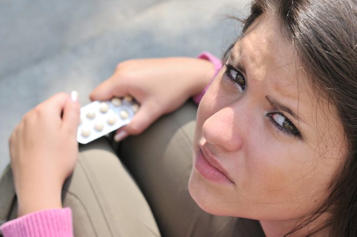 signs that your teen could be addicted - teen taking pills - mountain laurel recovery center