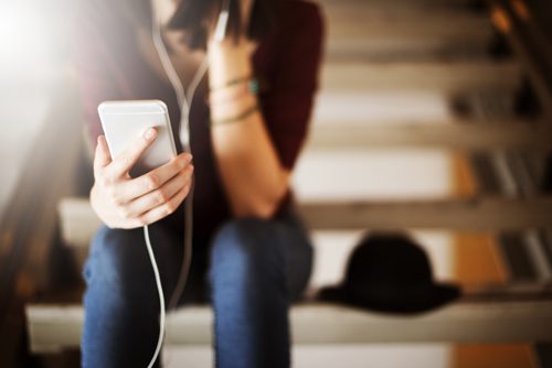 Music, the Brain, and Creating a Recovery Playlist - girl on stairs with ipod